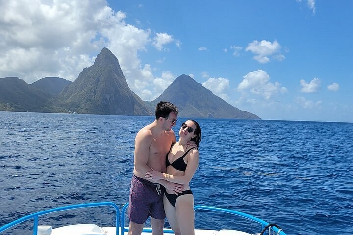 Couple on boat with the iconic Pitons Saint Lucia